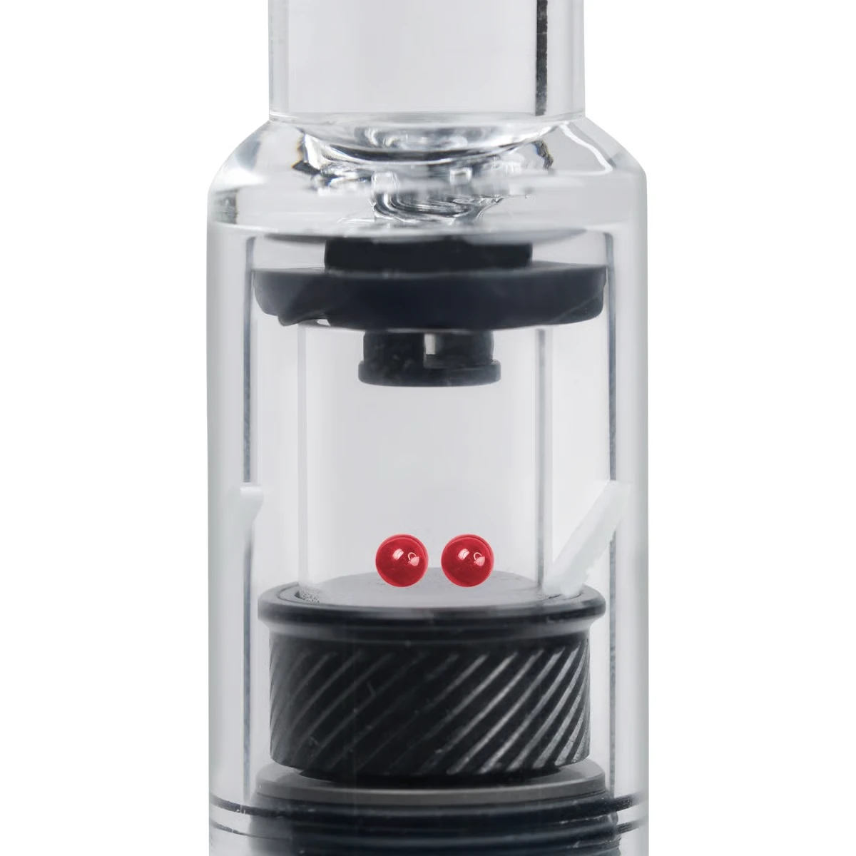 Close-up view of Utillian 6 quartz heating chamber with two red terp pearls inside glass body