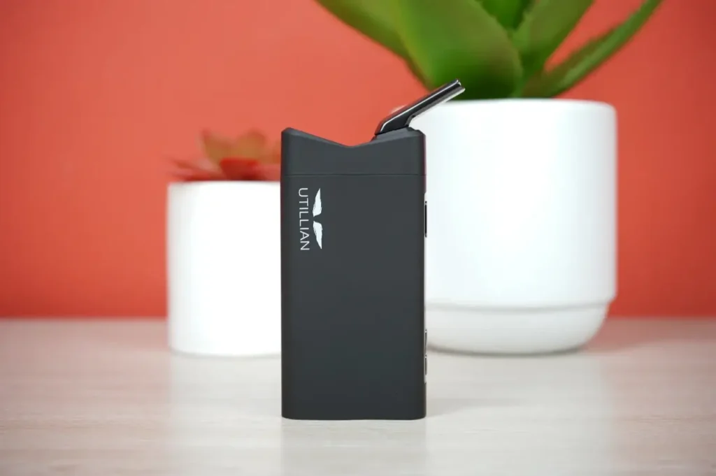 Full side profile of the assembled Utillian 850 portable vaporizer sitting upright on a table