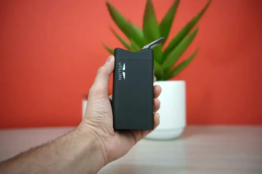 Testing the portability and size of the Utillian 850 vaporizer by holding it in hand