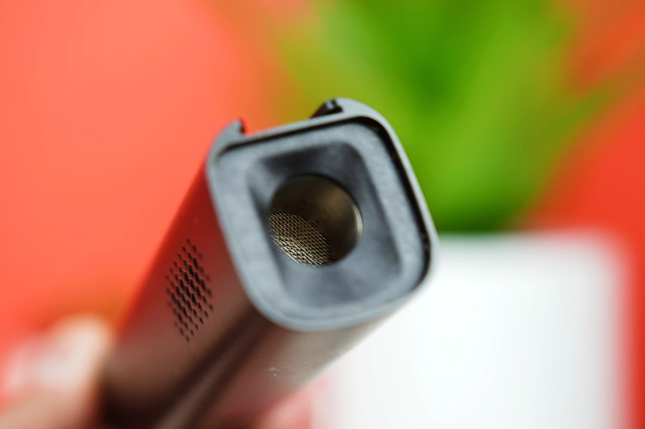 Close-up of the stainless steel heating chamber and mesh screen on the XMax V4 Pro dry herb vaporizer.
