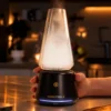 Tronian Omegatron 2 Vapor Cup in black with LED base ring filling glass cup with dense vapor